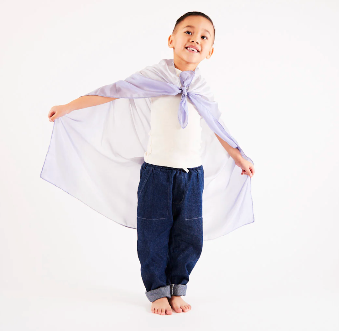 A child wears a playsilk as a cape The Doodle Post